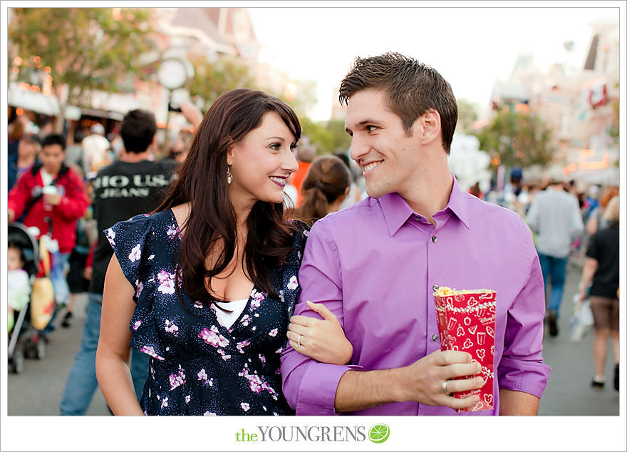 Disneyland engagement session, engagement at Disney, Disney themed engagement, theme park engagement session, engagement with Disney castle, cotton candy engagement, popcorn engagement