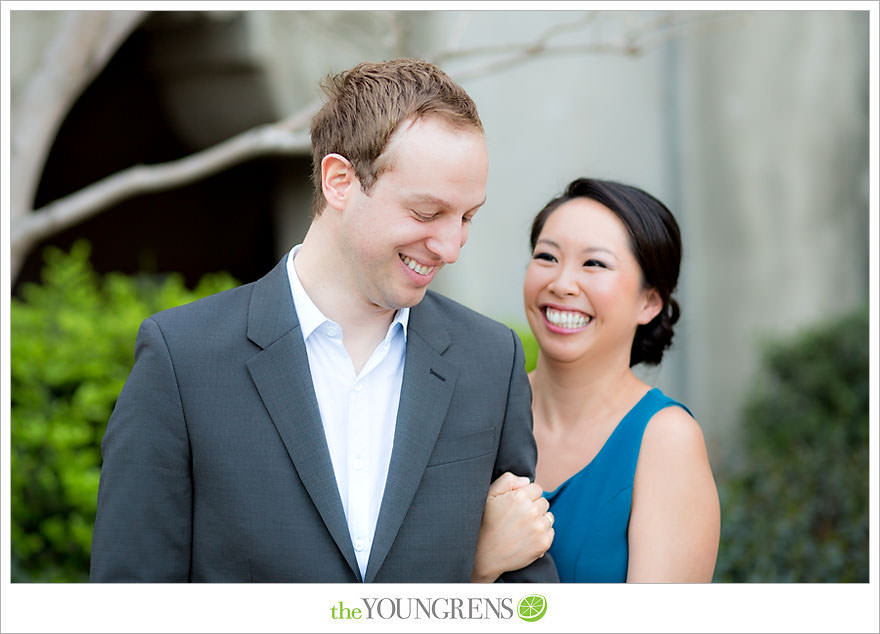 Balboa Park engagement session, Old Globe Theater engagement session, San Diego engagement session, Museum of Man engagement session, blue dress engagement session, grey suit engagement session, rose garden engagement session