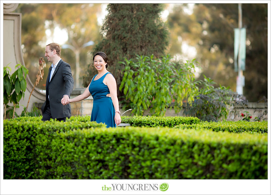 Balboa Park engagement session, Old Globe Theater engagement session, San Diego engagement session, Museum of Man engagement session, blue dress engagement session, grey suit engagement session, rose garden engagement session