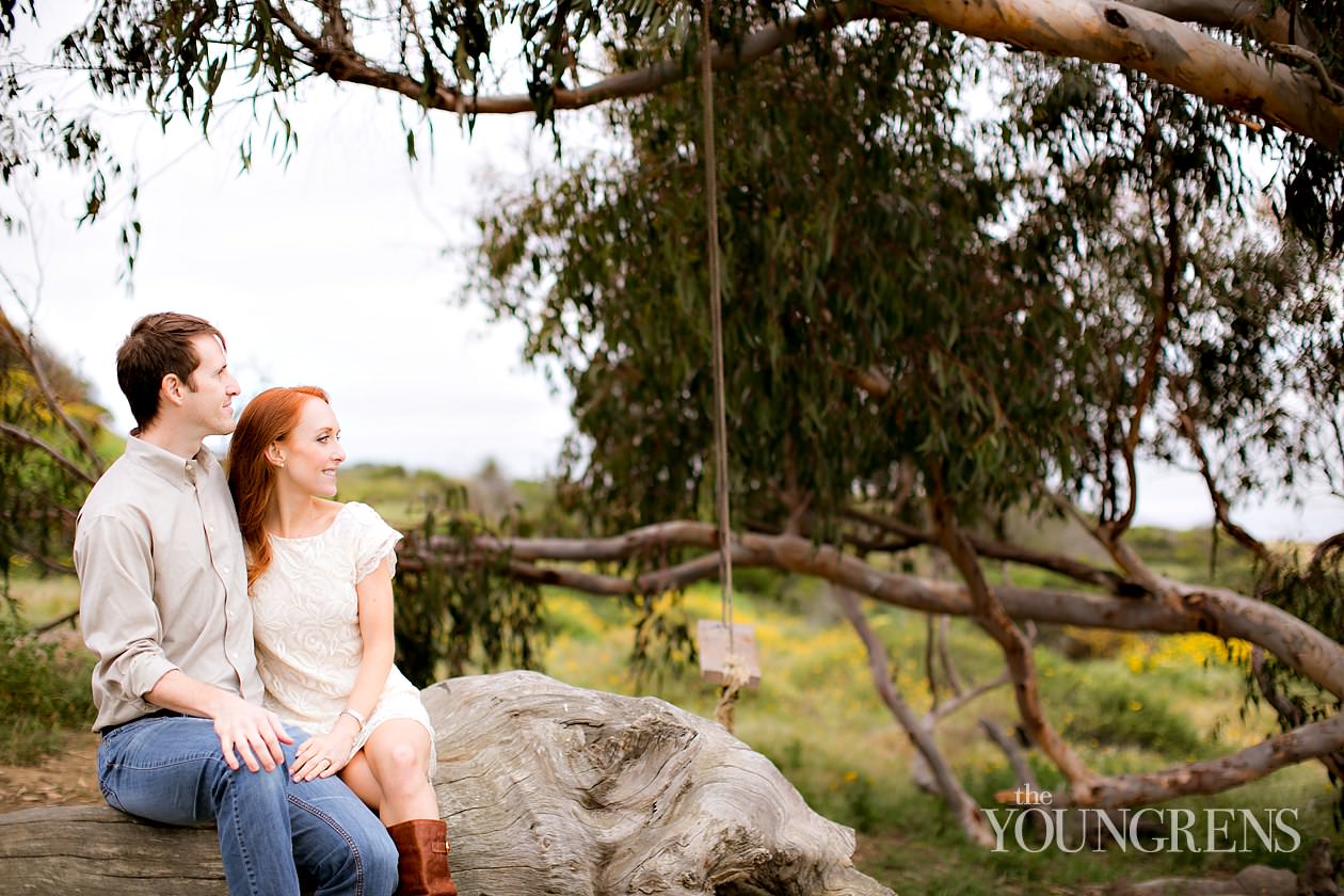 track and field engagement session, running engagement session, working out engagement, fitness engagement, running shoes engagement, PLNU engagement, Point Loma engagement, sunset cliffs engagement, swing engagement, meadow engagement, San Diego engagement, water bottle engagement, hot pink engagement