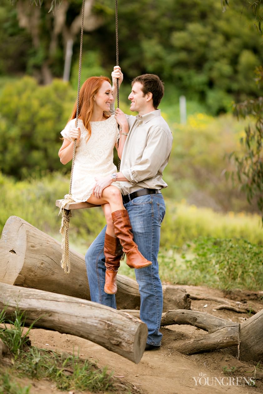 track and field engagement session, running engagement session, working out engagement, fitness engagement, running shoes engagement, PLNU engagement, Point Loma engagement, sunset cliffs engagement, swing engagement, meadow engagement, San Diego engagement, water bottle engagement, hot pink engagement