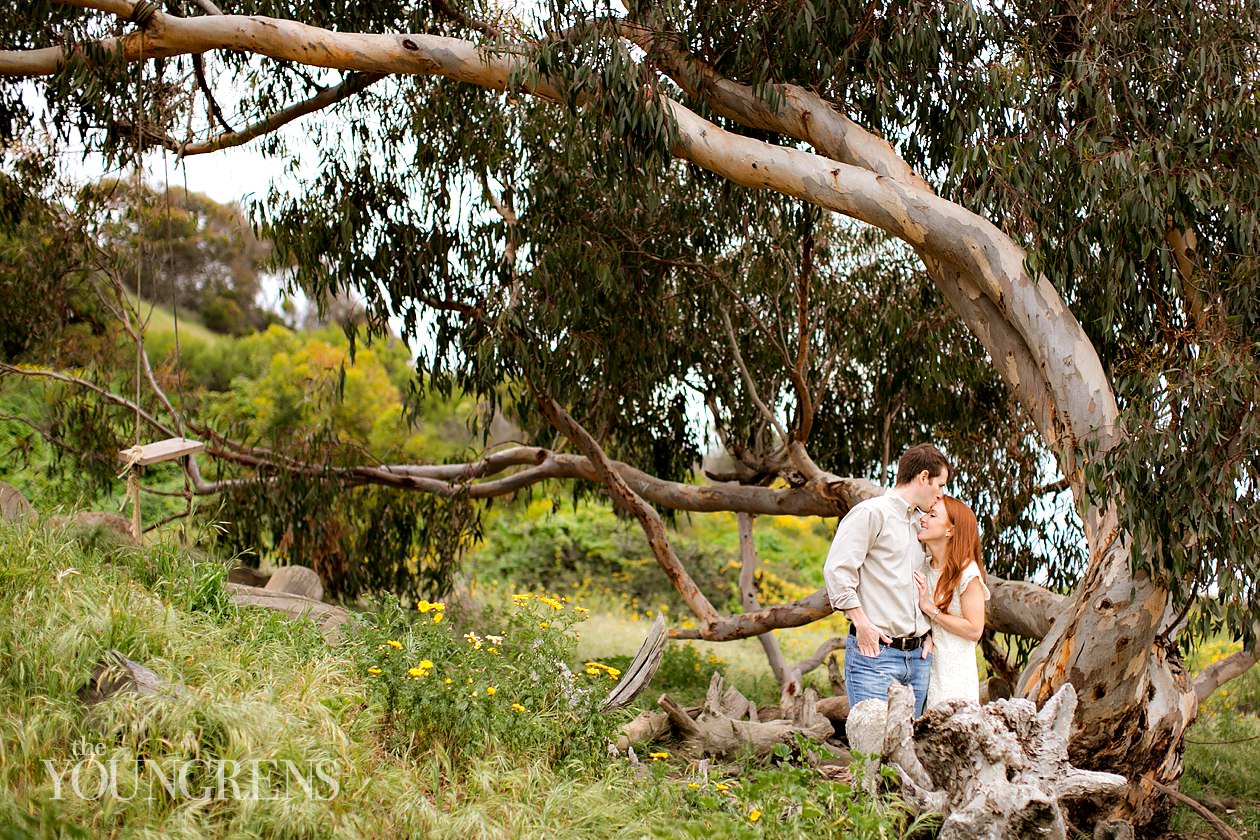 track and field engagement session, running engagement session, working out engagement, fitness engagement, running shoes engagement, PLNU engagement, Point Loma engagement, sunset cliffs engagement, swing engagement, meadow engagement, San Diego engagement, water bottle engagement, hot pink engagement