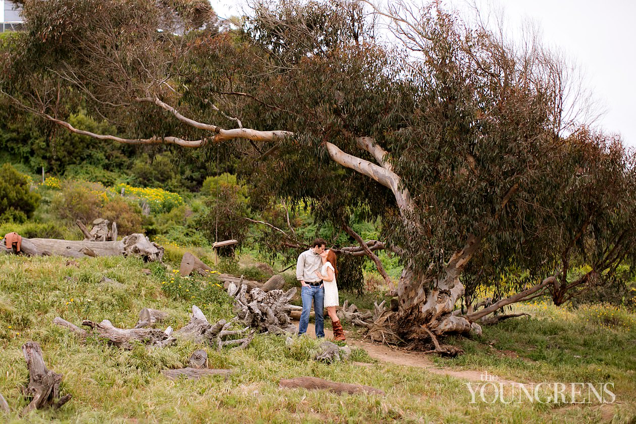 track and field engagement session, running engagement session, working out engagement, fitness engagement, running shoes engagement, PLNU engagement, Point Loma engagement, sunset cliffs engagement, swing engagement, meadow engagement, San Diego engagement, water bottle engagement, hot pink engagement